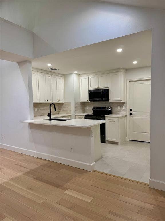 3706 Aries Drive, Garland, TX 75044 Modern kitchen with shaker-style cabinetry, quartz countertops, and a subway tile backsplash