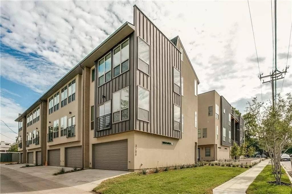 4303 Cole Avenue, #17, Dallas, TX 75205 Contemporary multi-story facade featuring varied paneling, stucco siding, multiple large windows, and integrated two-car garages