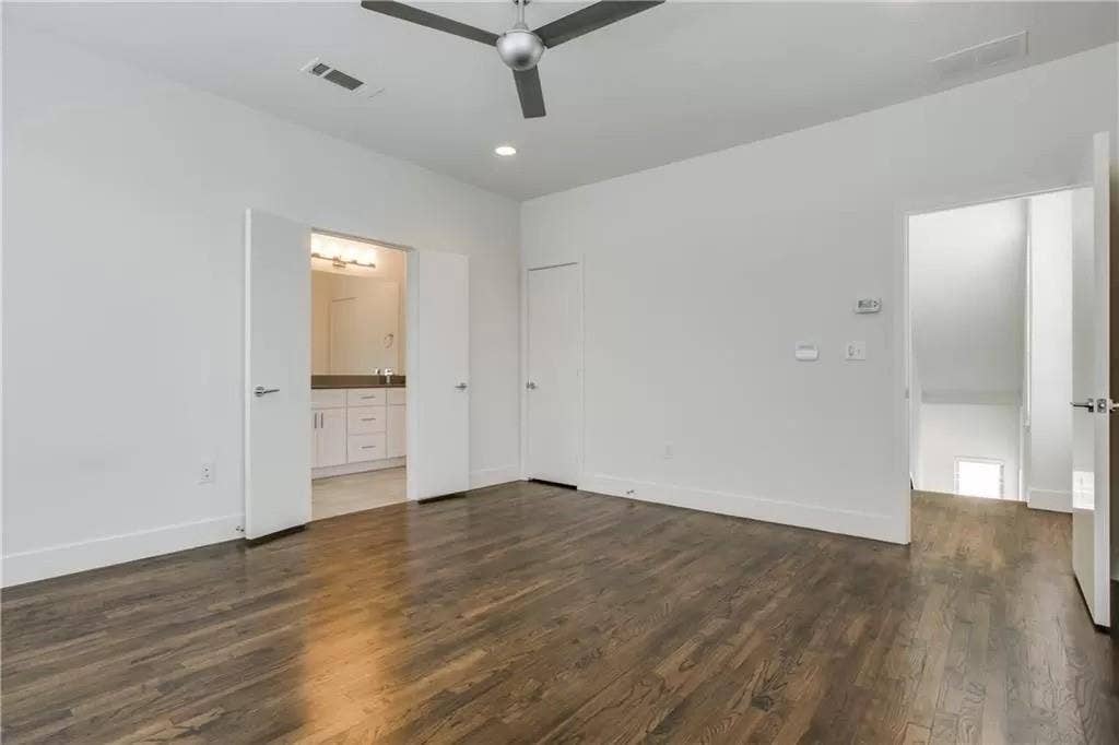 4303 Cole Avenue, #17, Dallas, TX 75205 Wood-finish flooring, recessed lighting, modern ceiling fan, white walls, and double doors