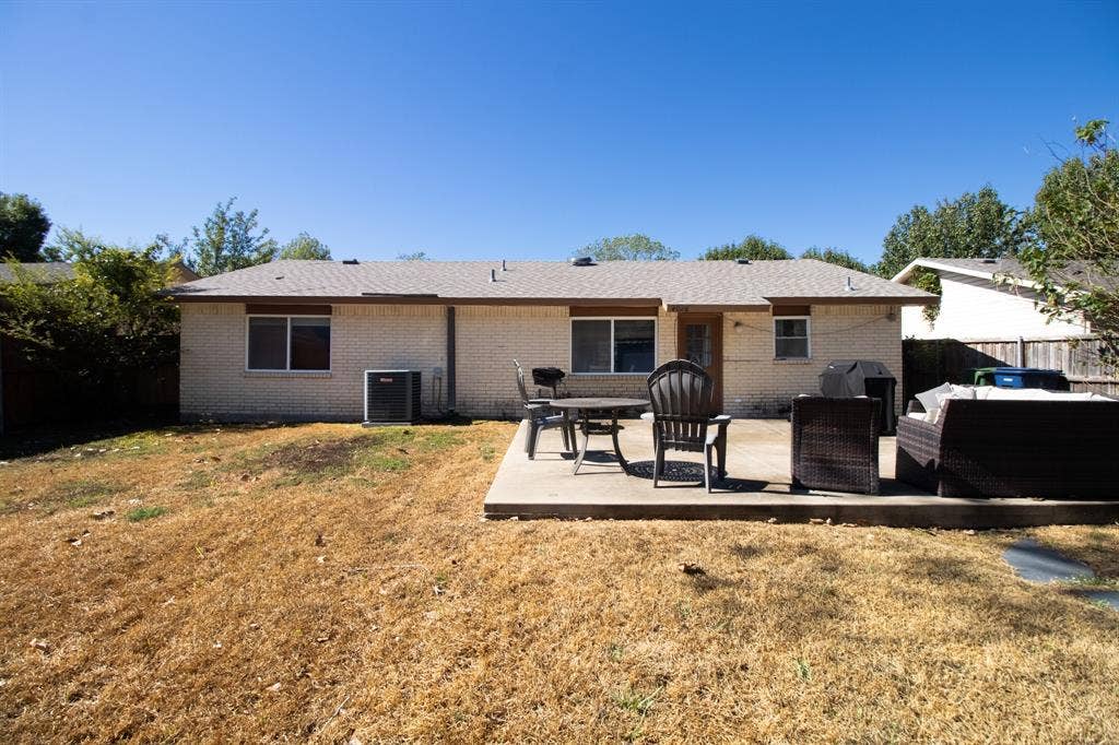 4026 Salem Drive, Garland, TX 75043 Spacious, fenced backyard with expanded open patio and shed.