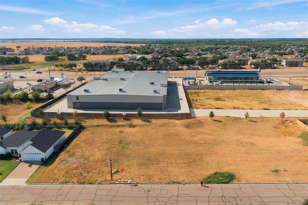 9924 Bridlewood Lane, Waco, TX 76708 Expansive undeveloped lot with existing street access and a clear perimeter