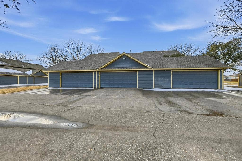 Multiple garage doors with horizontal paneling