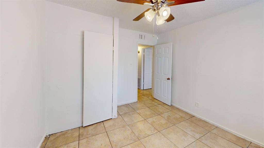 1710 Meridian Way, Garland, TX 75040 Tiled flooring throughout, featuring a ceiling fan with integrated lighting