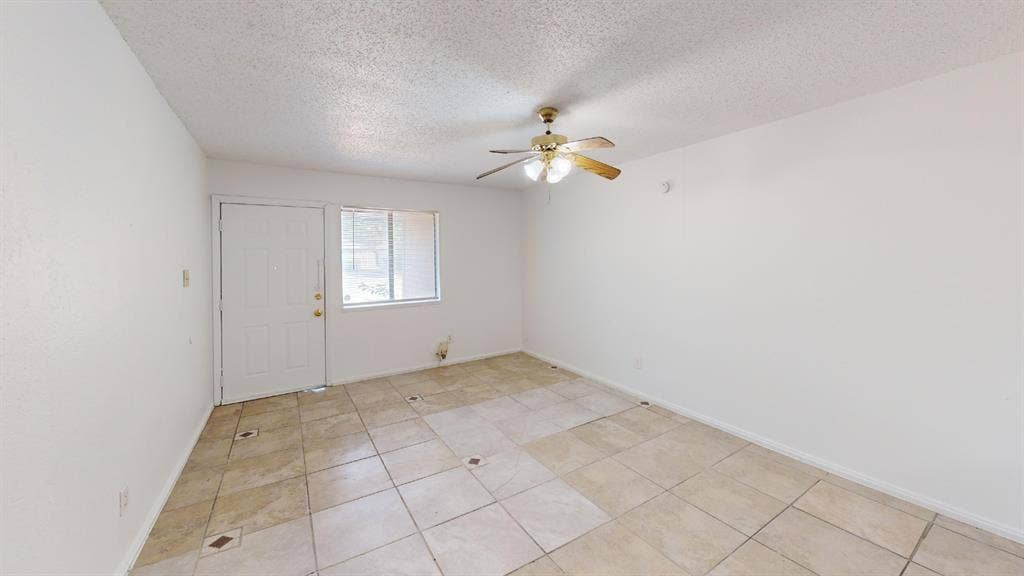 1710 Meridian Way, Garland, TX 75040 Recessed ceiling with a brass-finish ceiling fan, tiled flooring, and a window with blinds