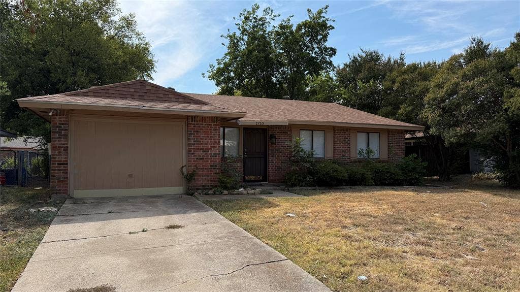 1710 Meridian Way, Garland, TX 75040 Brick exterior with a single-car garage and a concrete driveway