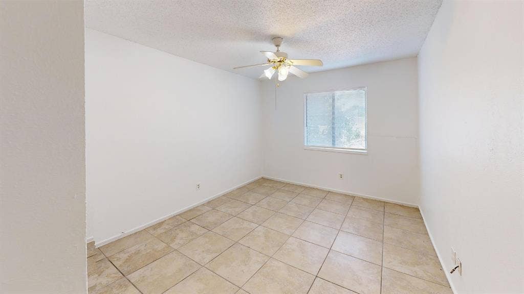 1710 Meridian Way, Garland, TX 75040 Tiled flooring, overhead ceiling fan, and a window with natural light