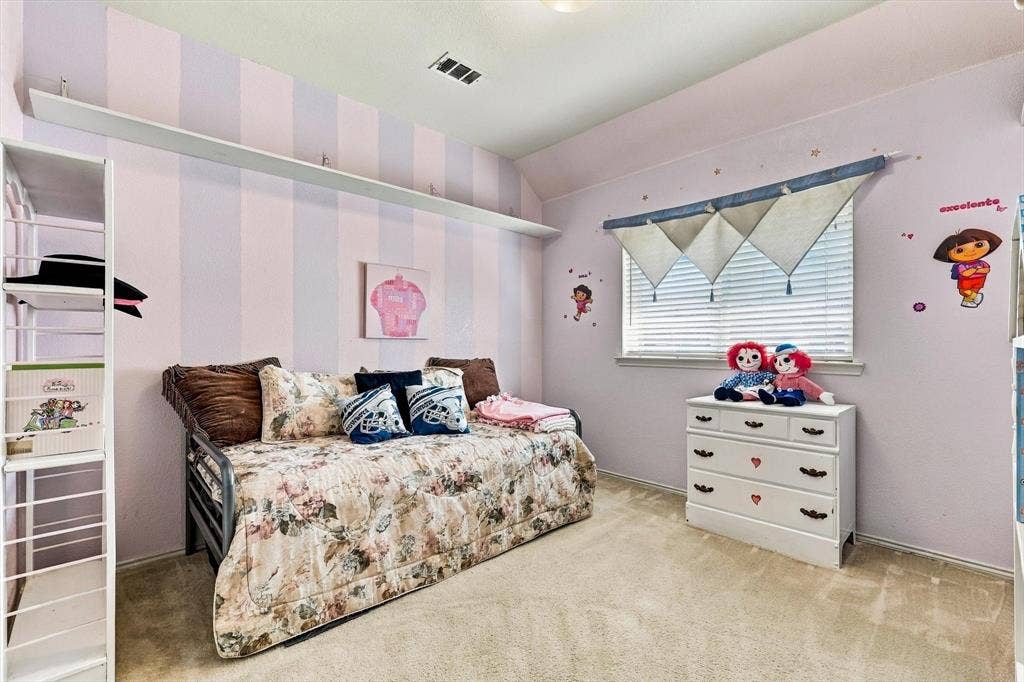 Wall-to-wall carpeting with a neutral finish, complemented by a window with horizontal blinds