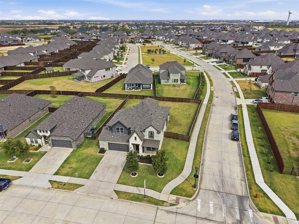 Established neighborhood setting with concrete sidewalks and streetlights