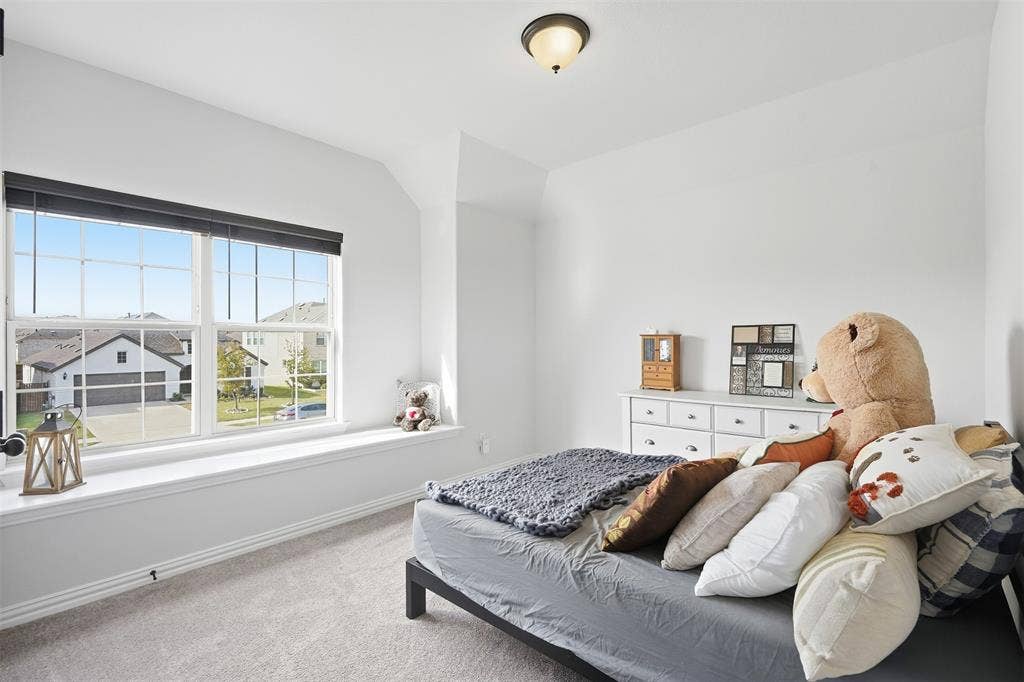 Recessed window with a spacious window seat, grid-pattern windows, and a flush mount ceiling light