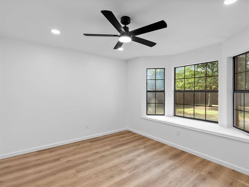6716 Gold Dust Trail, Dallas, TX 75252 Wood-finish flooring, recessed lighting, and a modern ceiling fan