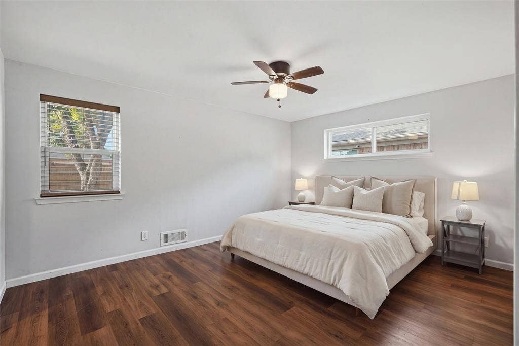 5221 Elkridge Drive, Dallas, TX 75227 Primary bedroom with wood flooring