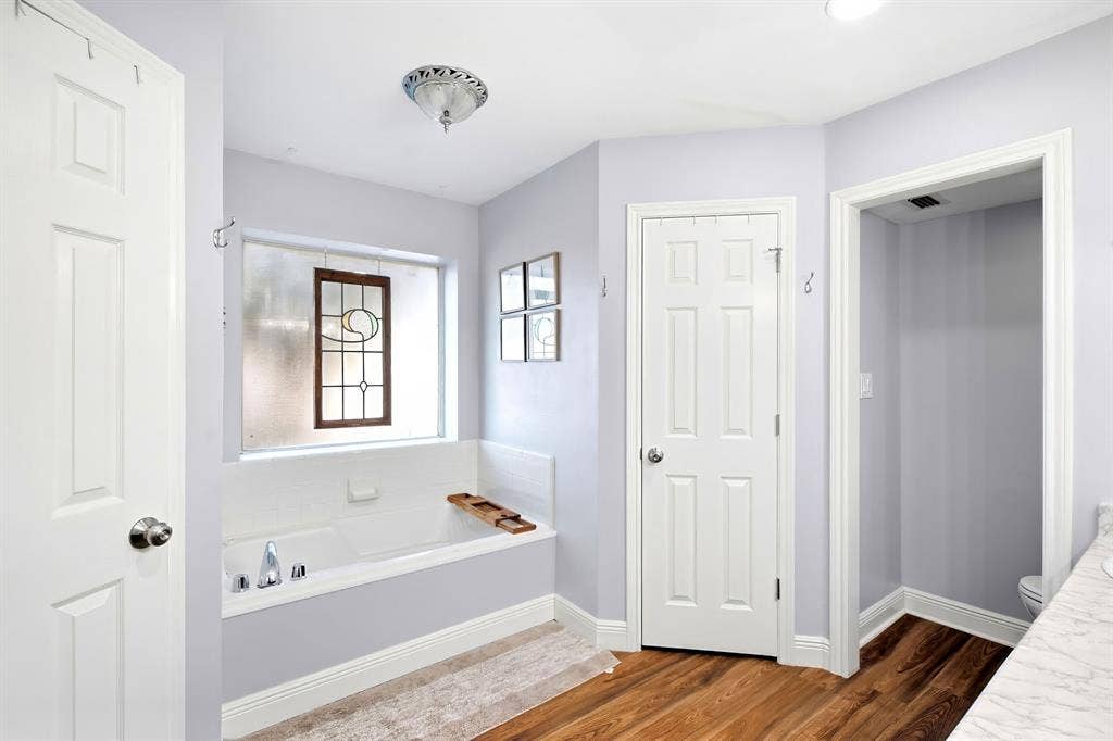 506 Amy Jo Circle, Aubrey, TX 76227 Built-in bathtub with polished chrome fixtures, accented by a decorative stained-glass window