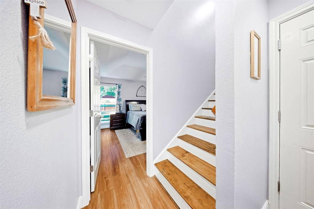506 Amy Jo Circle, Aubrey, TX 76227 Wood-finish flooring, white painted risers, and light-colored walls