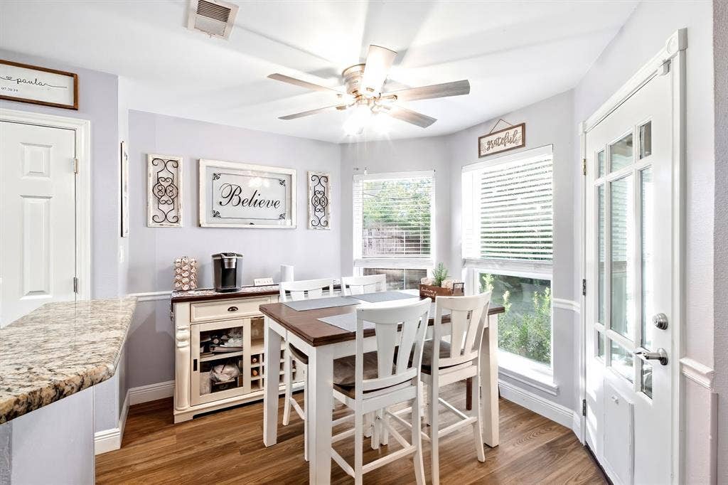 506 Amy Jo Circle, Aubrey, TX 76227 Wood-finish flooring, granite countertop, multiple windows with blinds, ceiling fan, and a transom door