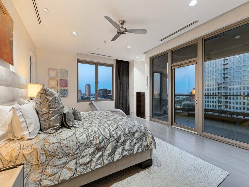 2300 Wolf Street, #14A, Dallas, TX 75201 Recessed lighting, ceiling fan, expansive windows, glass-paneled door, and wood-finish flooring
