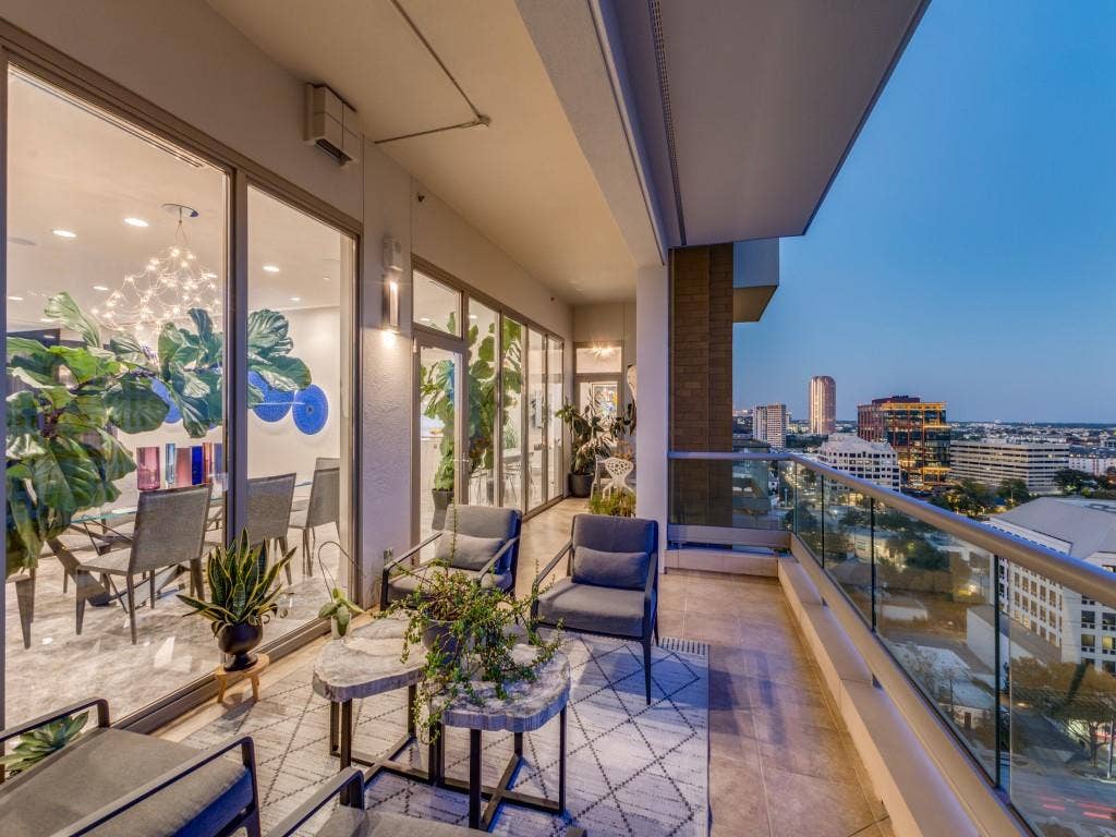 2300 Wolf Street, #14A, Dallas, TX 75201 Expansive outdoor balcony featuring a tiled surface and a glass railing system