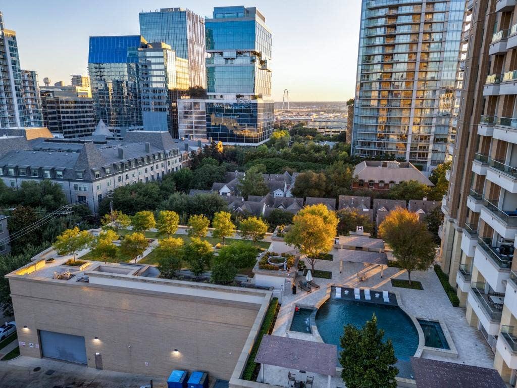 2300 Wolf Street, #14A, Dallas, TX 75201 Rooftop green space, multiple pools, established trees, paved courtyards, and urban architecture