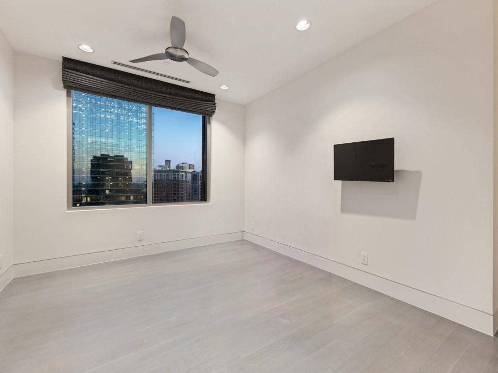 2300 Wolf Street, #14A, Dallas, TX 75201 Interior room featuring wood-finish flooring, recessed lighting, a ceiling fan, and large windows with integrated window treatments