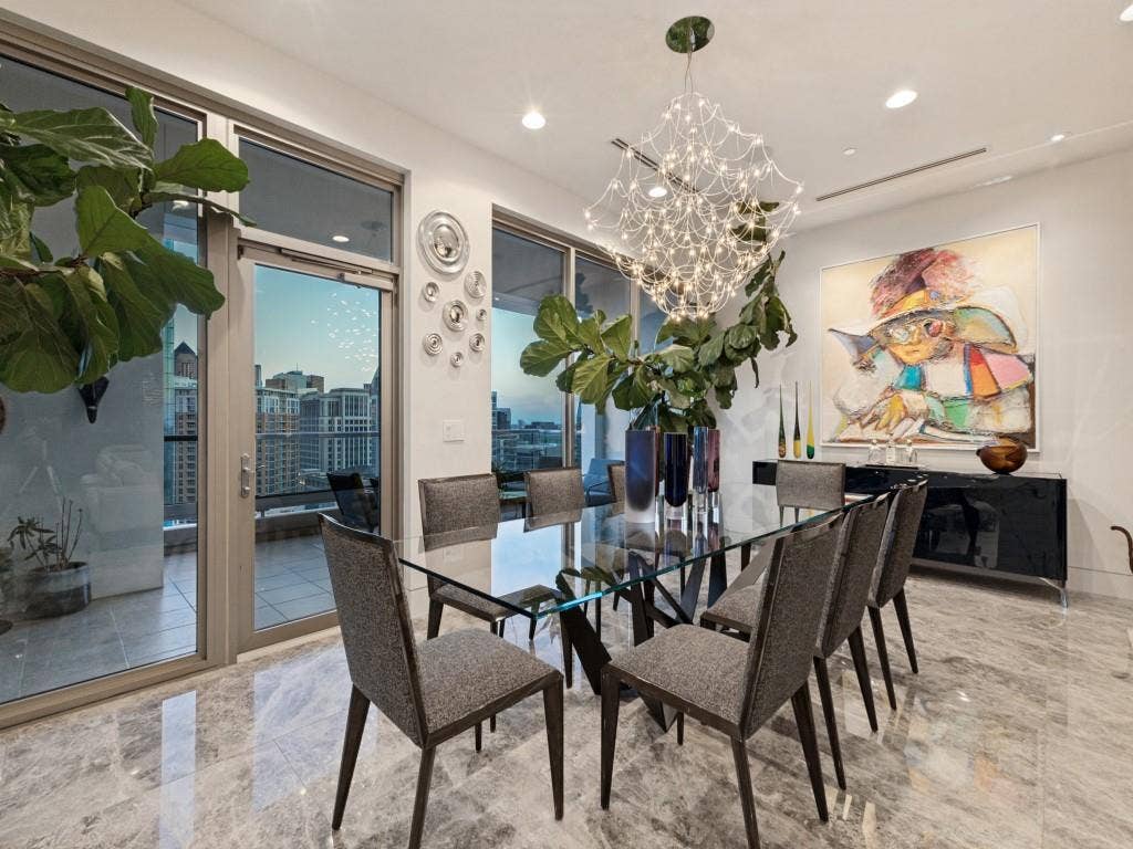 2300 Wolf Street, #14A, Dallas, TX 75201 Spacious room featuring large glass sliding doors, recessed lighting, and a unique chandelier