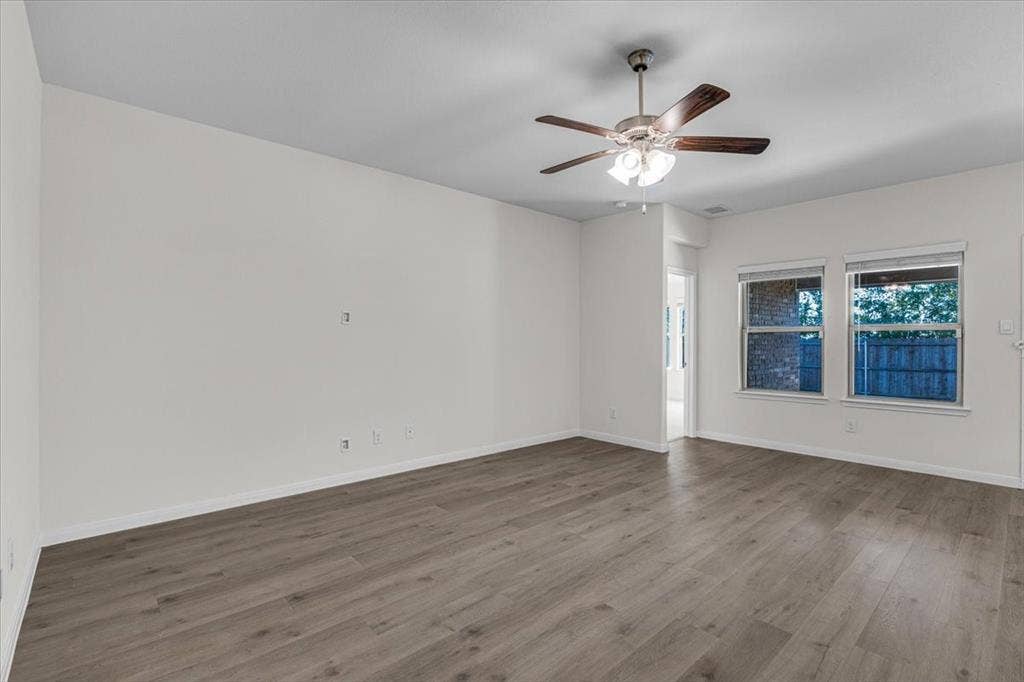 108 Timber Drive, Caddo Mills, TX 75135 Large family room with a view of the backyard