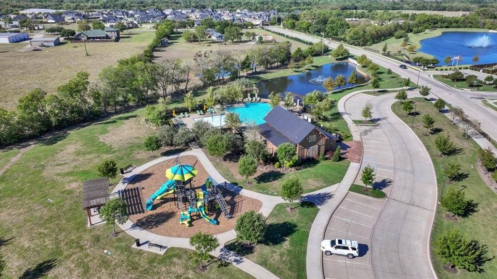 108 Timber Drive, Caddo Mills, TX 75135 Aerial view of the Trailstone community pool, park, and pond