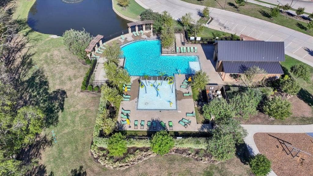 108 Timber Drive, Caddo Mills, TX 75135 Aerial view of the Trailstone community pool, park, and pond