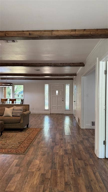 8513 Ravenswood Road, Granbury, TX 76049 Wood-finish flooring throughout, exposed ceiling beams, white entry door with frosted glass sidelights, and white trim molding