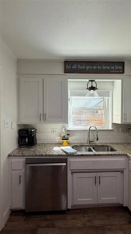 8513 Ravenswood Road, Granbury, TX 76049 Kitchen featuring white shaker-style cabinetry, granite countertops, subway tile backsplash, stainless steel dishwasher, and a double basin sink with a gooseneck faucet