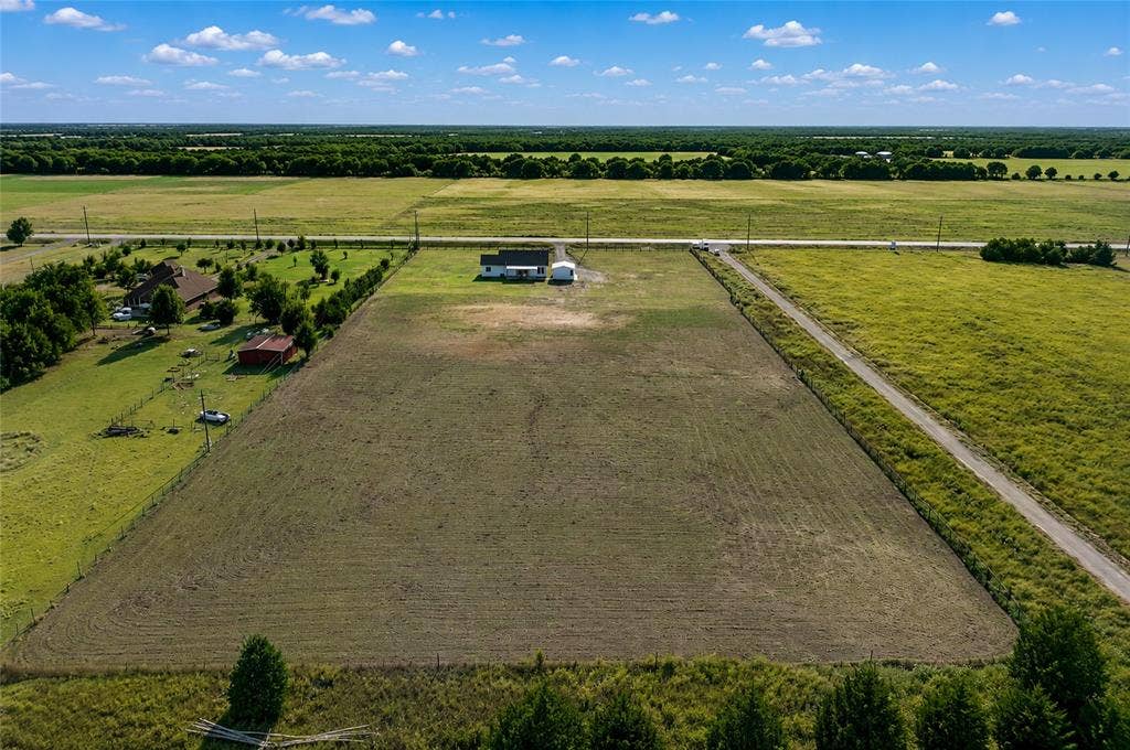 15166 FM 3133, Anna, TX 75409 Expansive rural property featuring a primary residence and additional structures