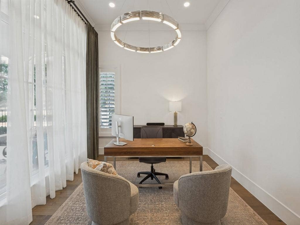 6801 Corporate Drive, #C2, Plano, TX 75024 Beautiful work or study area is also adjacent to the living room. There are large windows overlooking the patio, and plantation shutters on the back side of the room for privacy. The wonderful chandelier is the accent of the room!