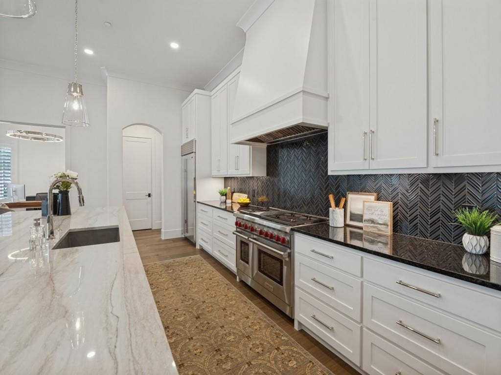 6801 Corporate Drive, #C2, Plano, TX 75024 Tons of drawers and a beautiful herringbone backsplash to compliment the counter tops.
