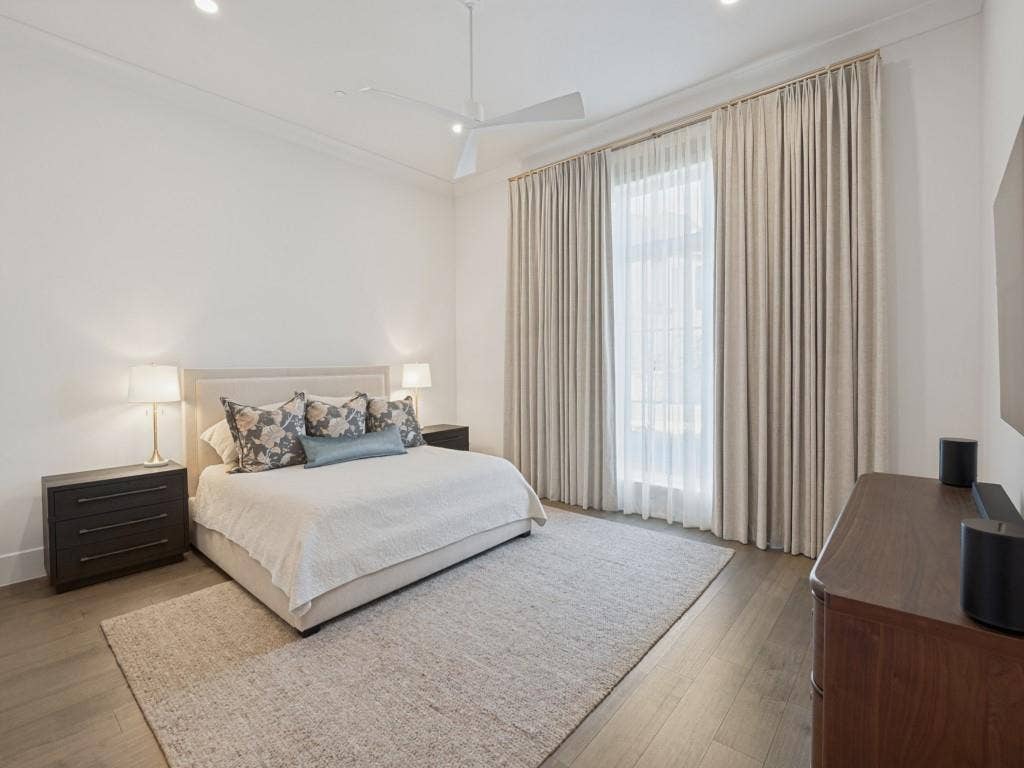 6801 Corporate Drive, #C2, Plano, TX 75024 The primary bedroom is huge with plenty of room for furniture and beautiful custom drapery as well.