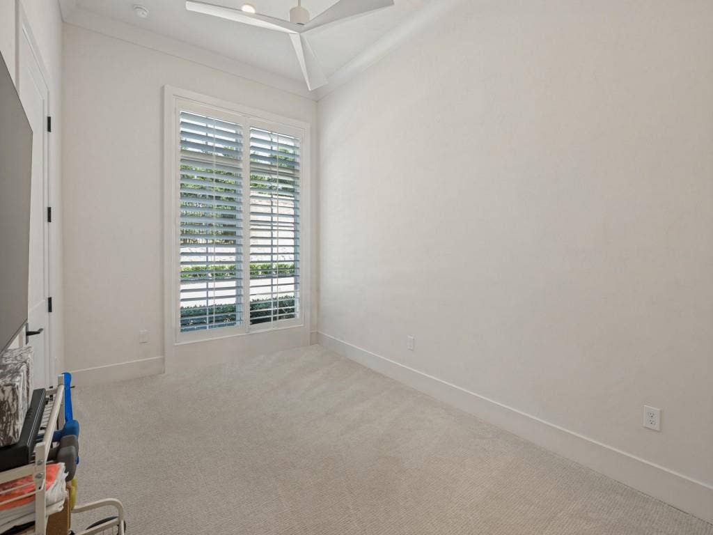 6801 Corporate Drive, #C2, Plano, TX 75024 The second bedroom is currently used as a home gym, but also makes a perfect quest bedroom featuring plantation shutters, a walk in closet, ceiling fan, and ensuite bathroom.
