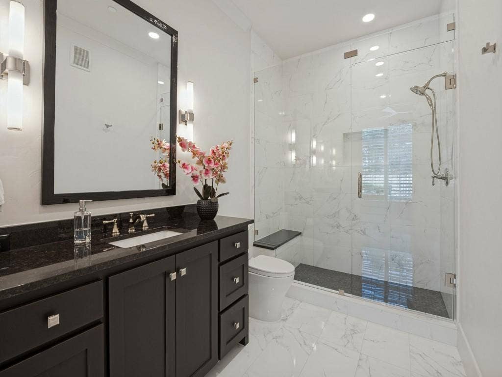 6801 Corporate Drive, #C2, Plano, TX 75024 Ensuite bathroom to the second bedroom features a large walk in shower as well.