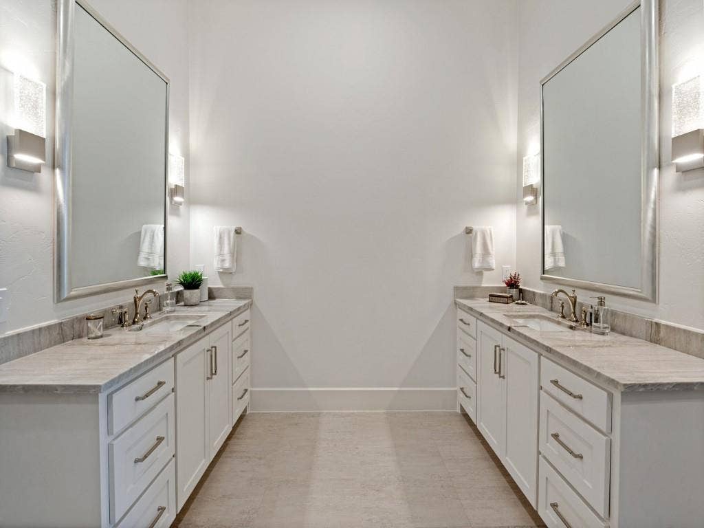 6801 Corporate Drive, #C2, Plano, TX 75024 Double vanities and large mirror with beautiful accent lighting.