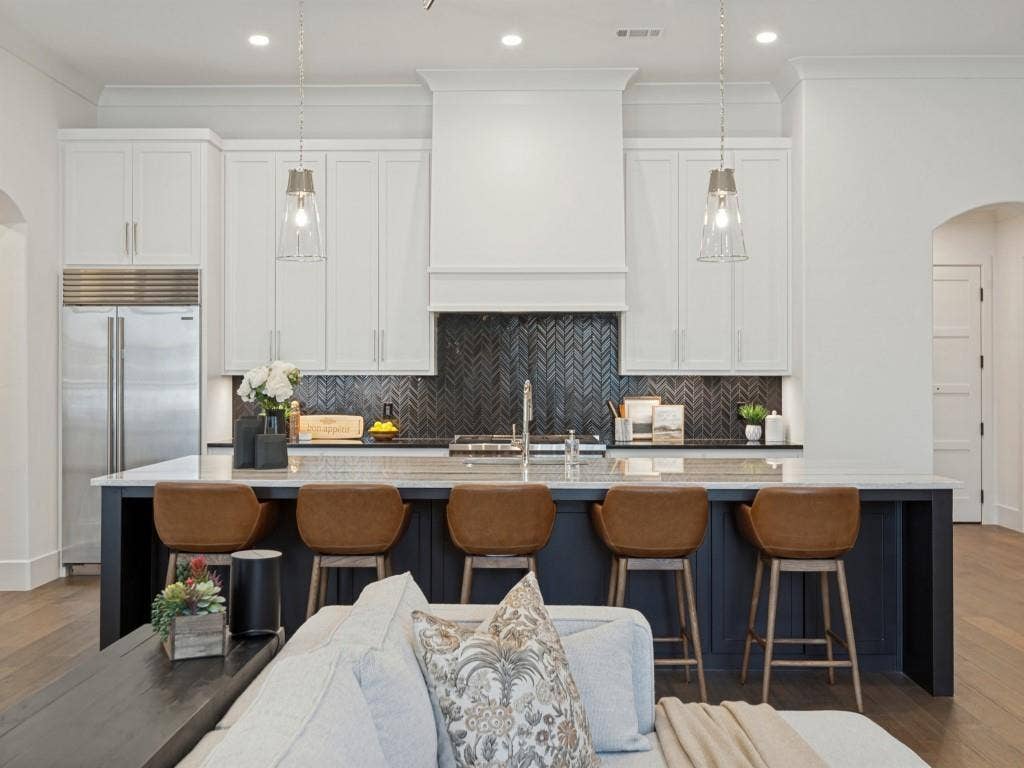 6801 Corporate Drive, #C2, Plano, TX 75024 The kitchen island is huge! Plenty of sitting space and great for serving!