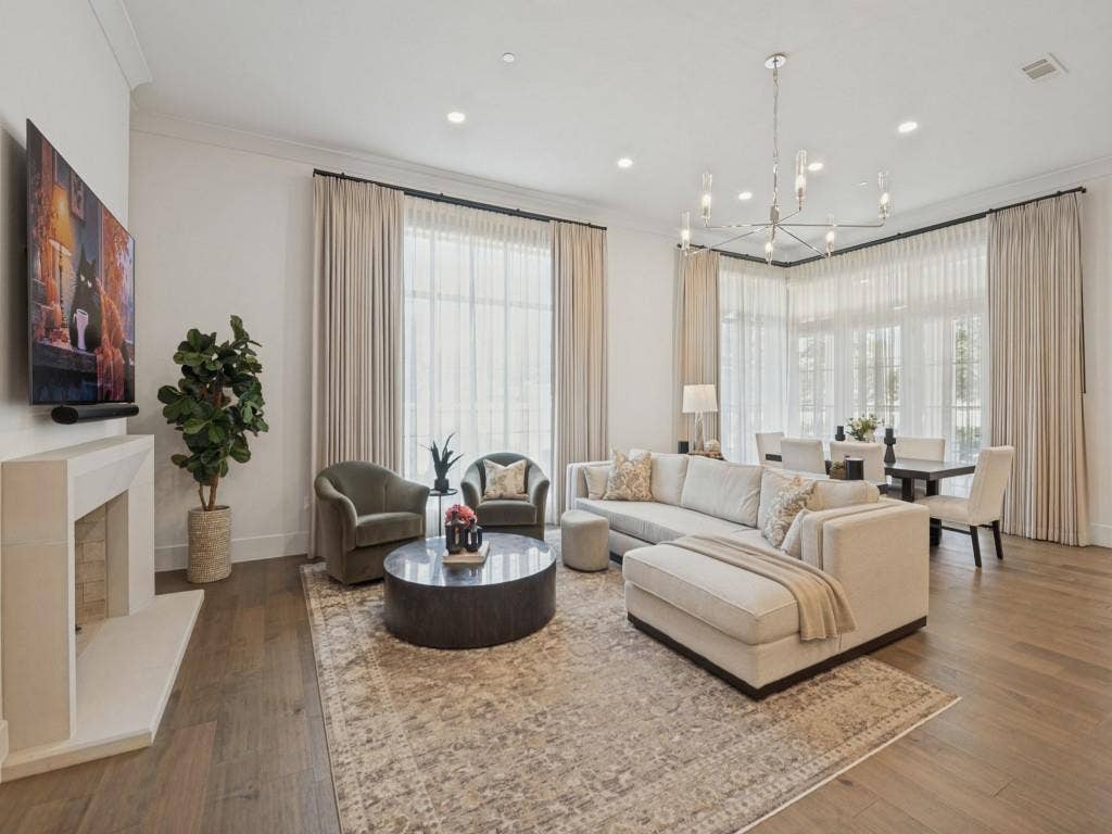6801 Corporate Drive, #C2, Plano, TX 75024 Beautiful open floor plan with wood floors and huge windows for natural light. Custom drapery recently installed.