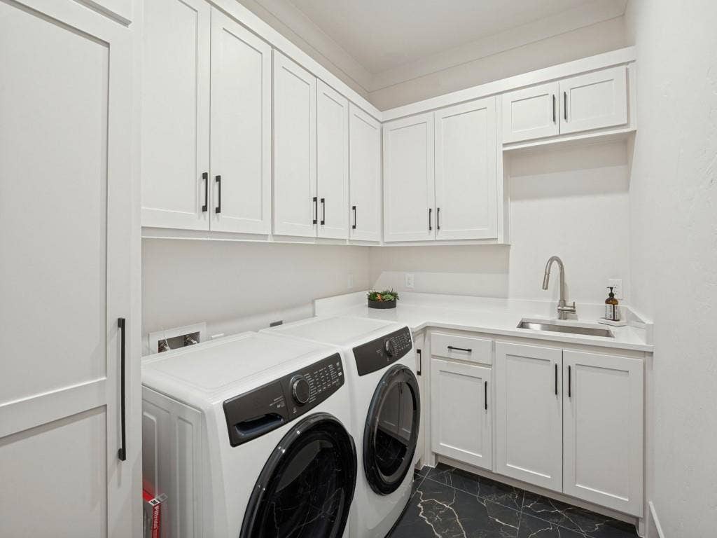 6801 Corporate Drive, #C2, Plano, TX 75024 Lots of cabinet space in the laundry room with a sink and utility closet.