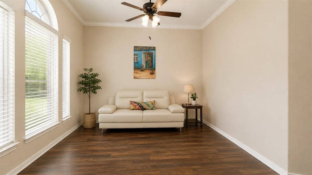7004 Canyonbrook Drive, Plano, TX 75074 Wood-finish flooring, white window blinds, arched window, ceiling fan with integrated lighting, and crown molding