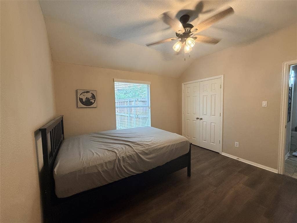 7004 Canyonbrook Drive, Plano, TX 75074 Vaulted ceiling, wood-finish flooring, ceiling fan with light fixture, double-door closet, and window with blinds