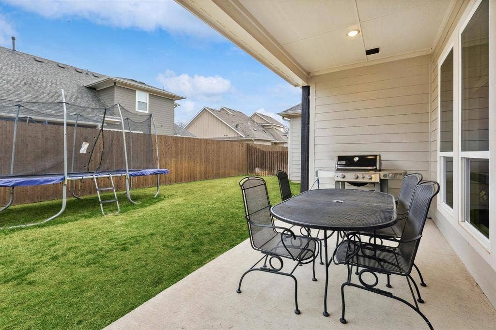 Covered concrete patio with recessed lighting
