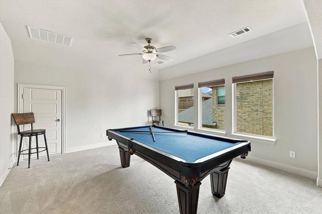 Upstairs is the complete entertainment space with game room and more