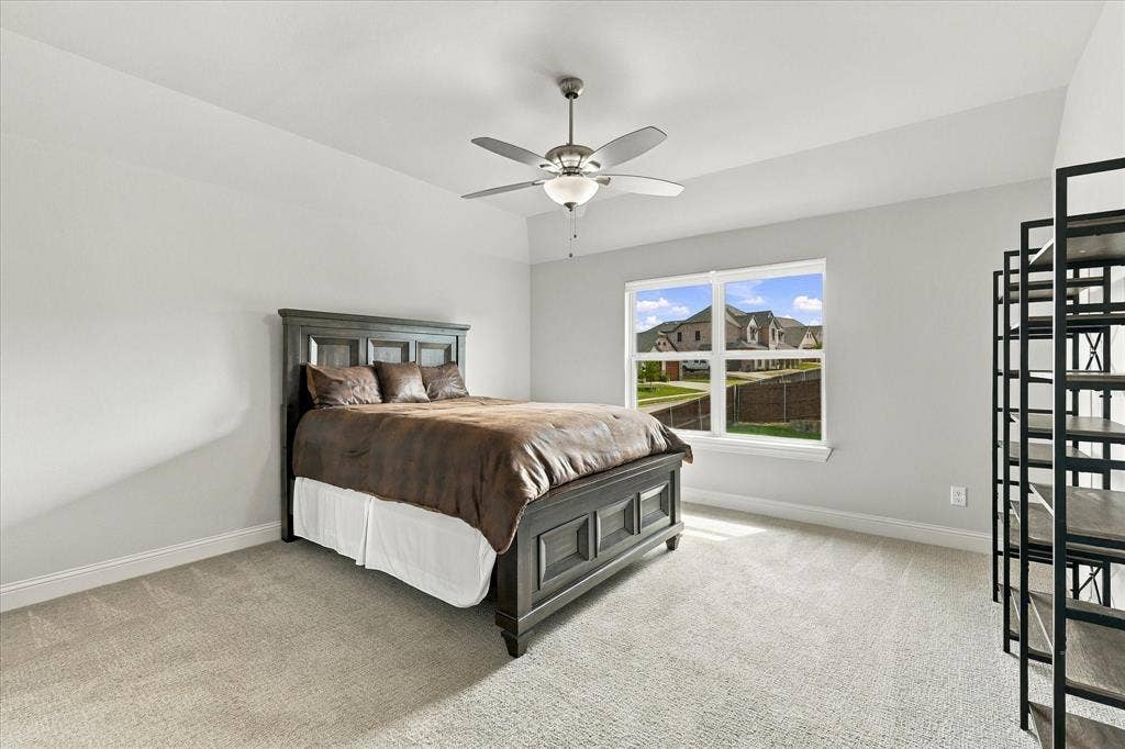 The second bedroom upstairs has views of the backyard
