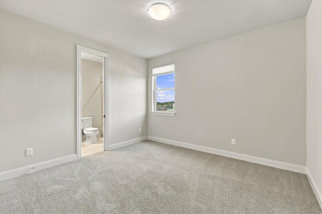 The second bedroom downstairs offers an ensuite bath