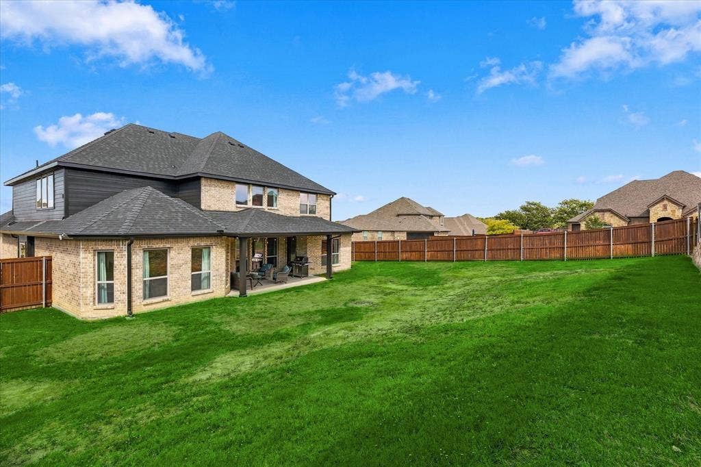 The backyard is just the right size for a pool, or playset, or even tiered landscaping