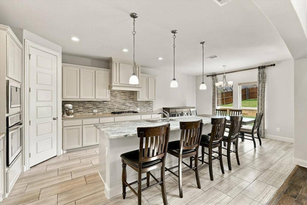 The spacious kitchen has island seating