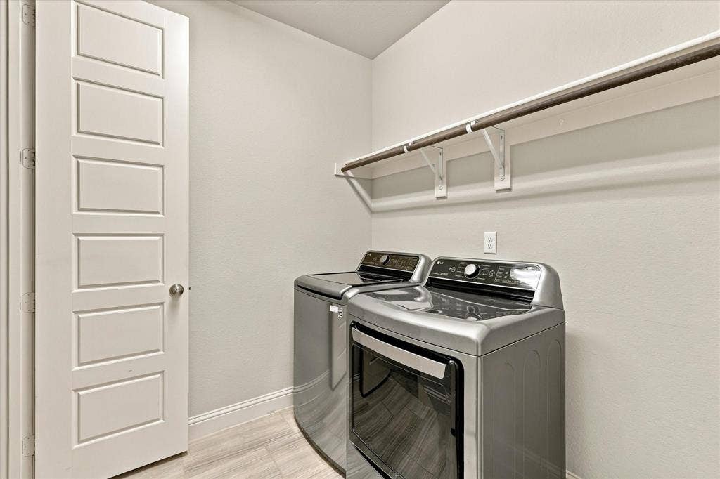 The laundry room has space for your tasks and supplies