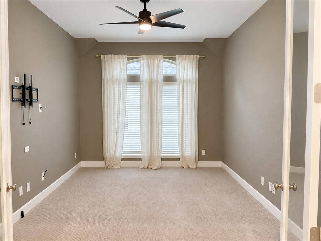 2234 Somercrest Place, Midlothian, TX 76065 Media Room neutral carpet flooring and glass panel doors