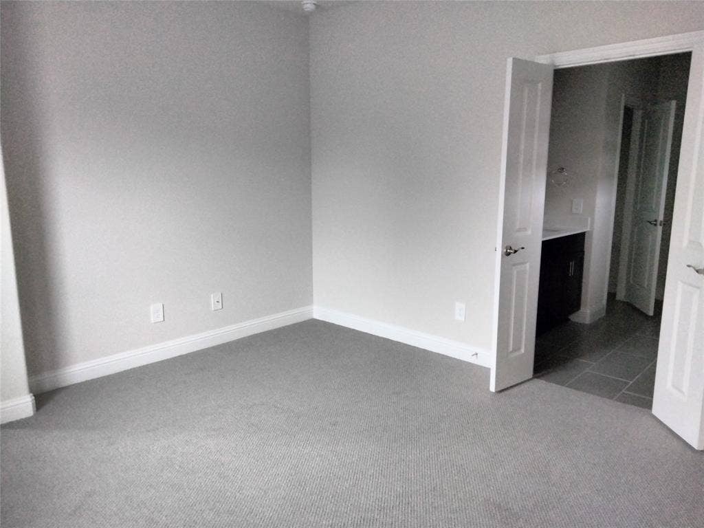 601 Willet Drive, McKinney, TX 75069 Gray carpeting, light gray wall paint, white trim, and white paneled doors