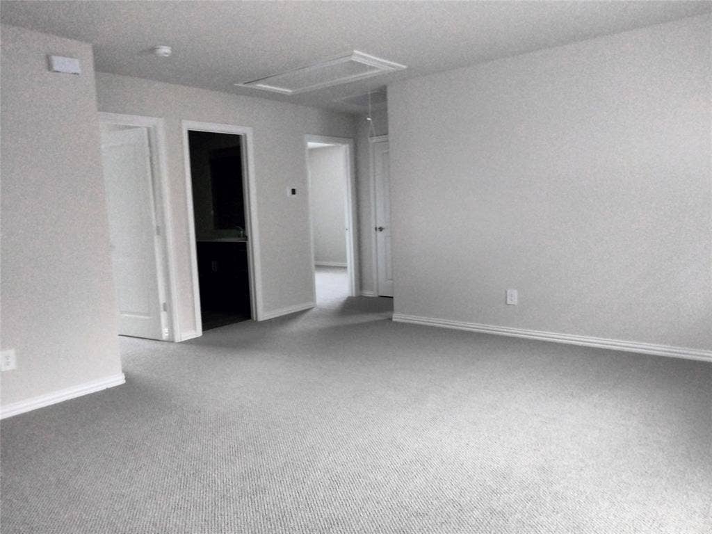 601 Willet Drive, McKinney, TX 75069 Expansive carpeted area with neutral wall finishes and multiple doorways